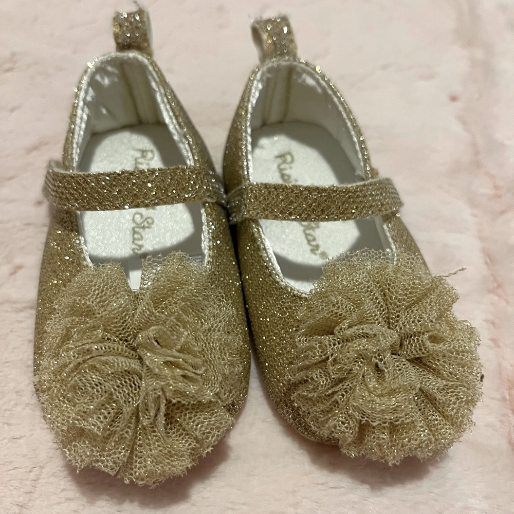 Gently used Rising Star gold baby slippers